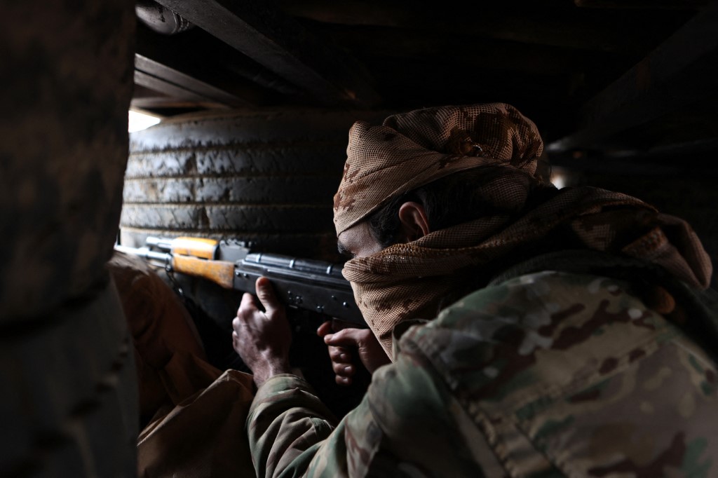 Fighter from Turkish-backed 'Syrian National Army' in Azaz, Aleppo, in area under control by Syrian government forces and the Syrian Democratic Forces (SDF), on 29 November 2022 (AFP)