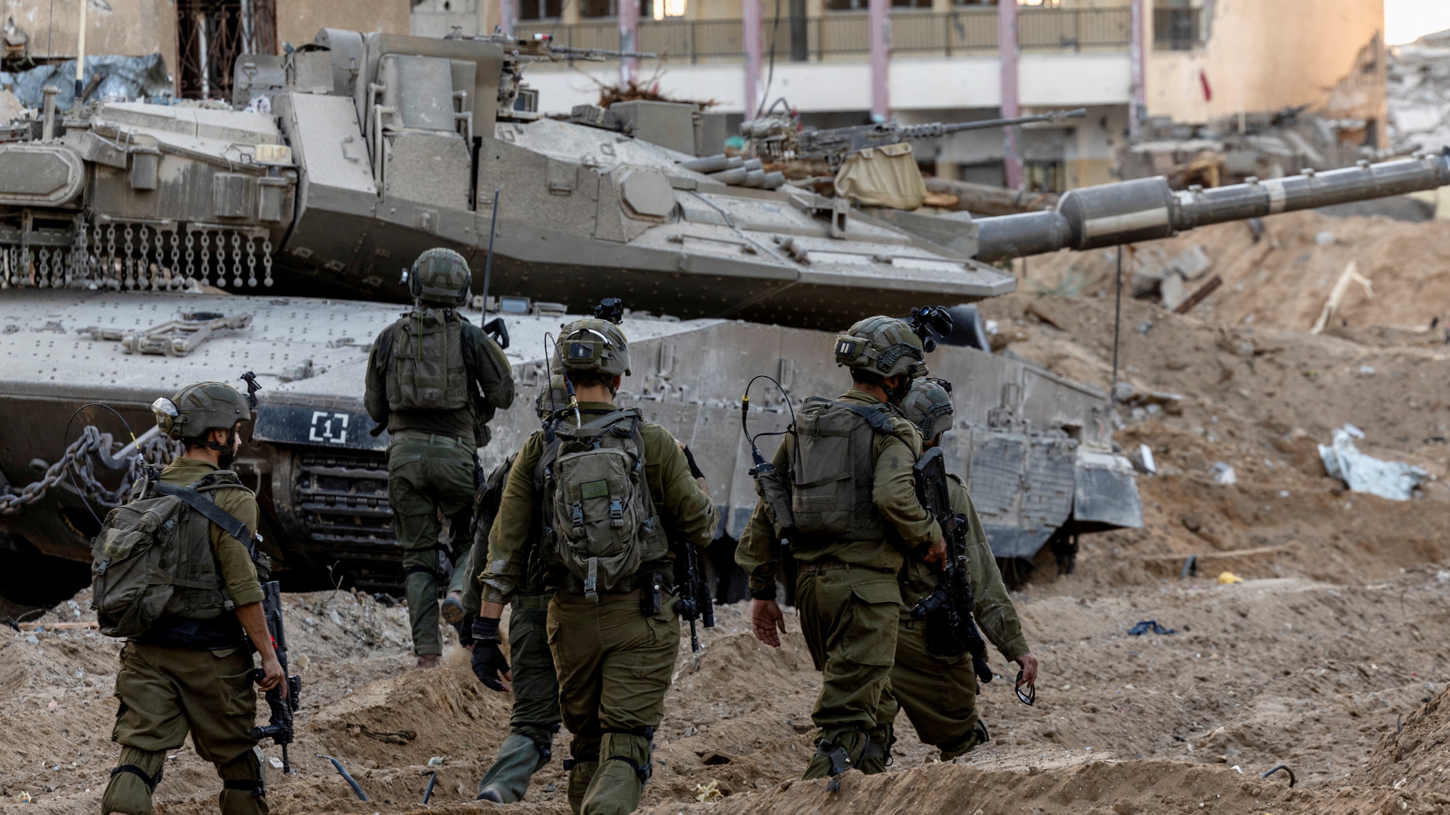 Israeli army walks through the devastation in Gaza