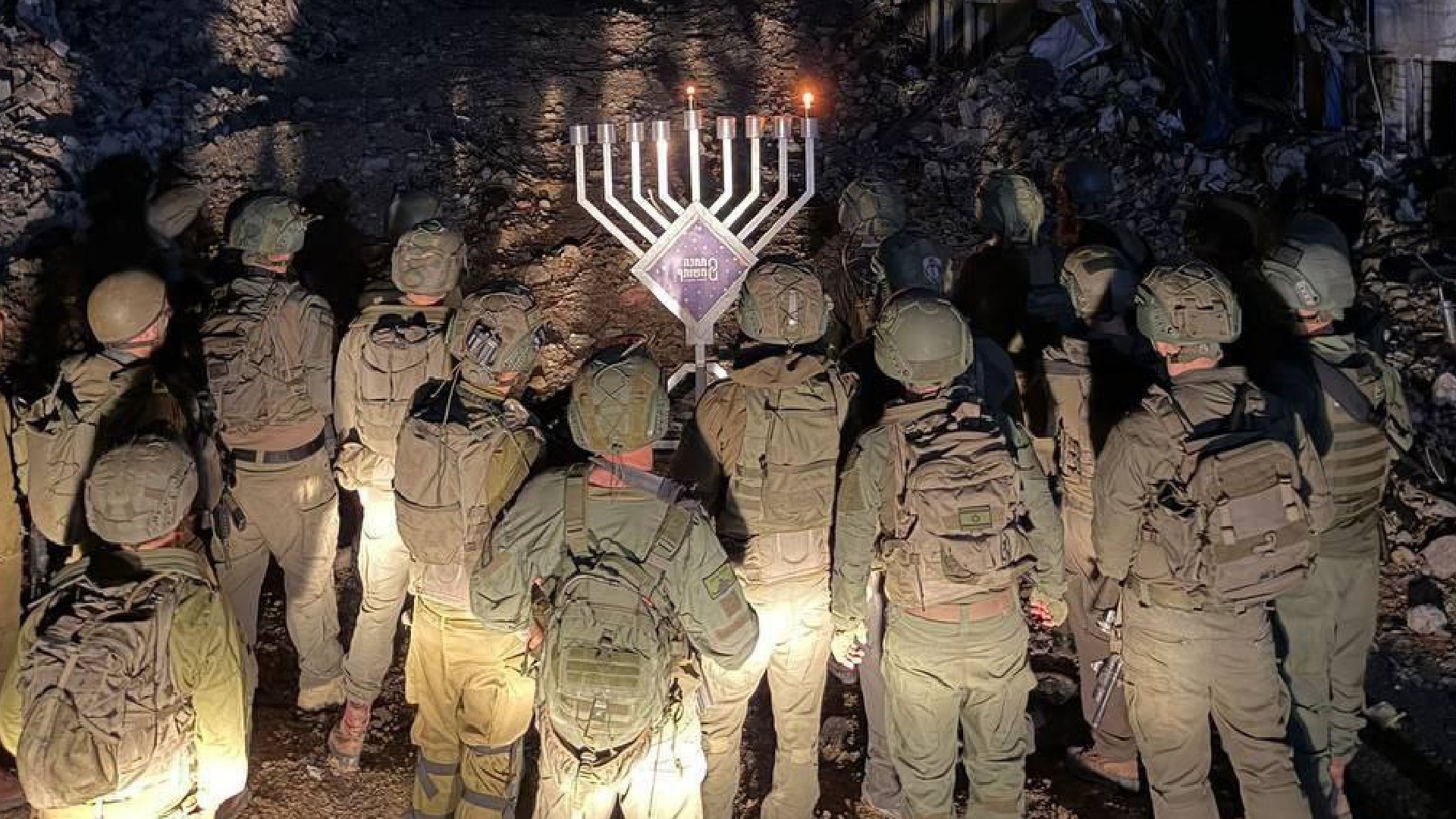 Israeli troops pictured lighting Hanukkah candles inside Tulkarm refugee camp in the occupied West Bank on 14 December 2025 (Social media)