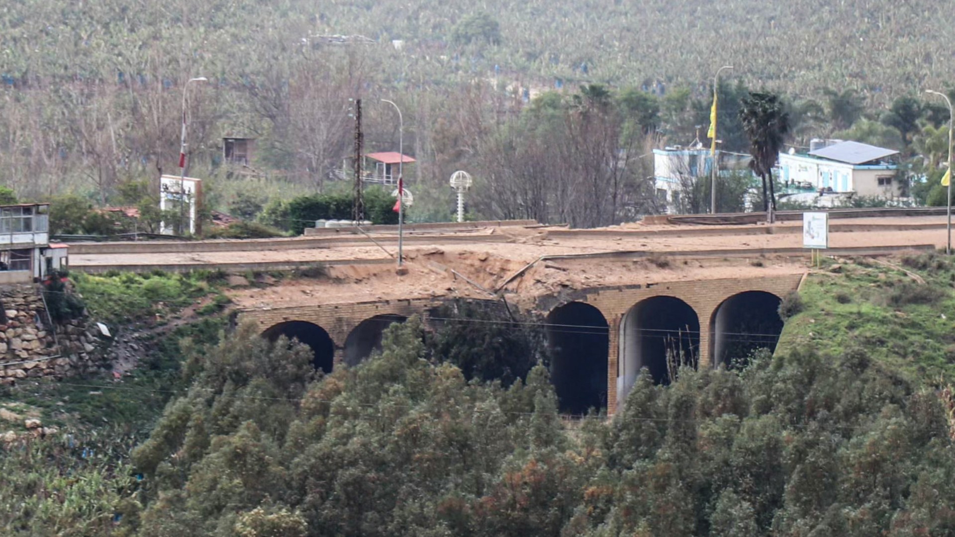 The damaged Qasmiyeh Bridge, located on a main highway linking villages in the Tyre district with others further north, following an Israeli air strike in southern Lebanon on 22 March 2026 (AFP/Kawnat Haju)