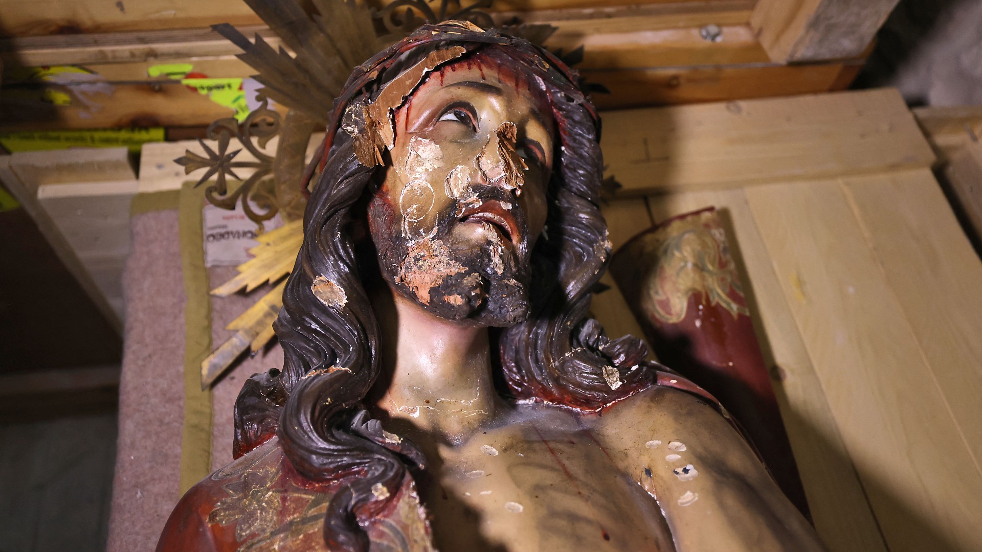 A picture shows a wooden statue of Jesus that was pulled down and damaged in the Church of the Condemnation, in Jerusalem's Old City on 2 February 2023 (AFP)