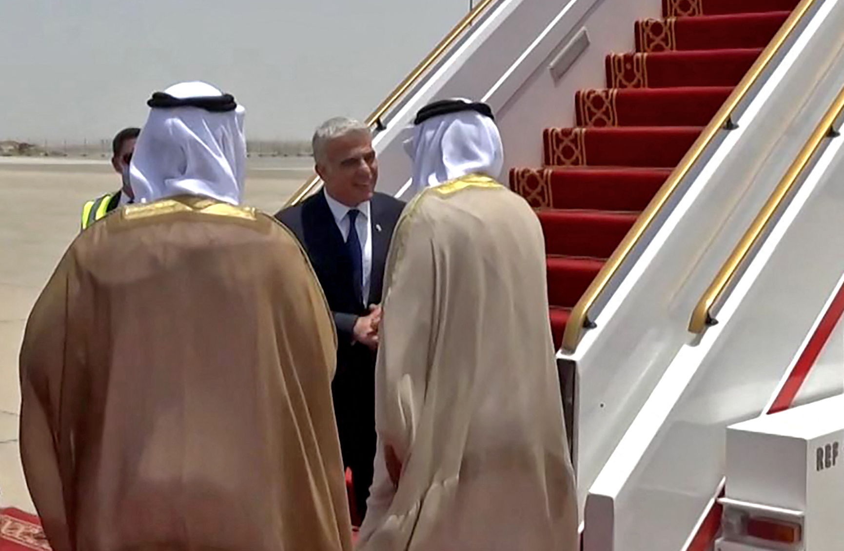 Lapid was welcomed at Abu Dhabi airport (AFP)