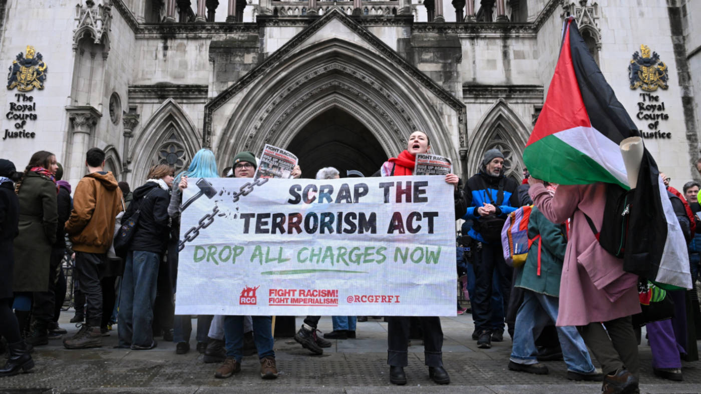 People protest outside the High Court in London on 13 February 2026, amid the ruling on the British government’s decision to designate Palestine Action as a terrorist organisation (Reuters)