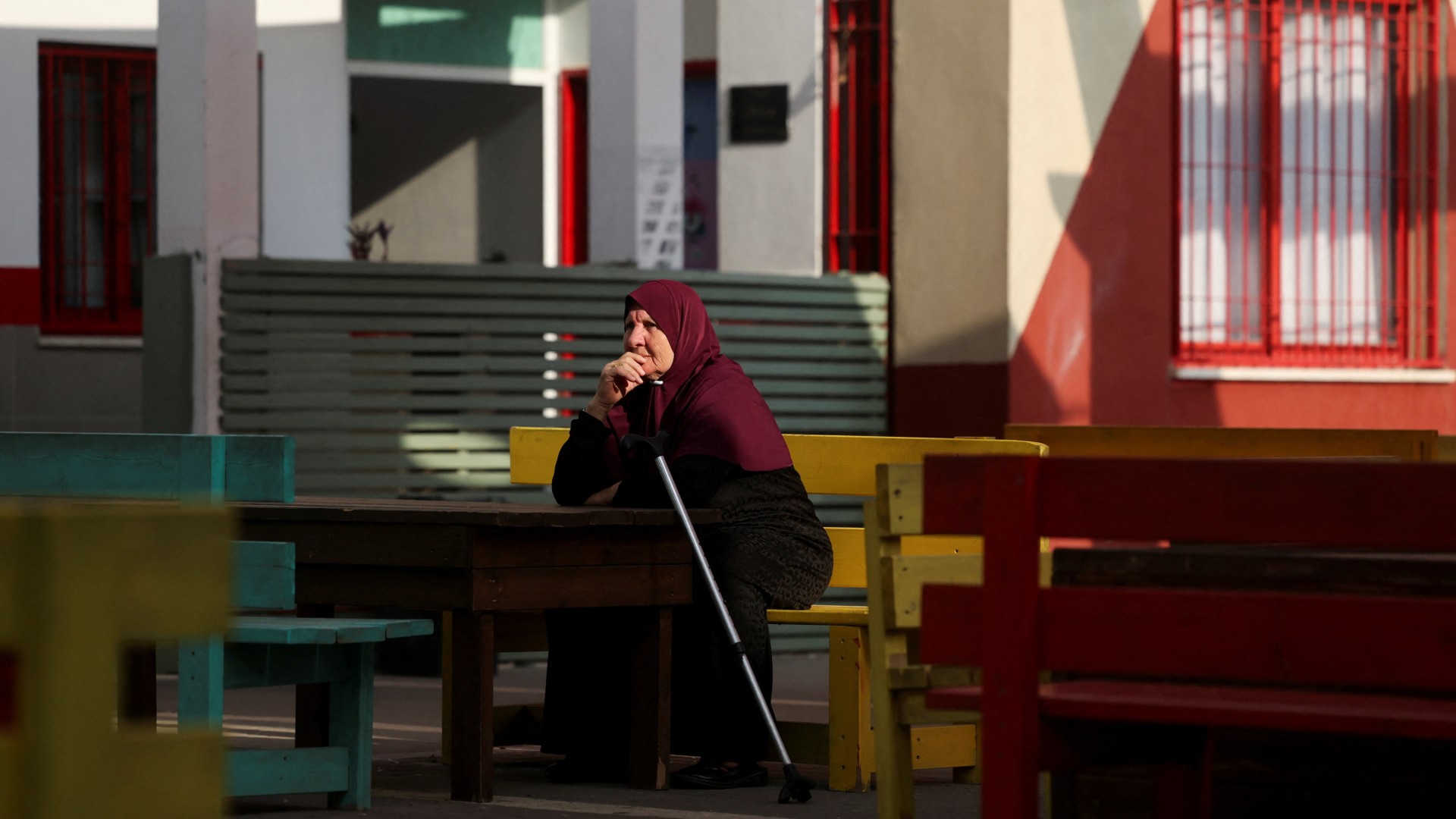 A woman waits to vote at a polling station during the national election in the Palestinian city of Umm al-Fahm, northern Israel