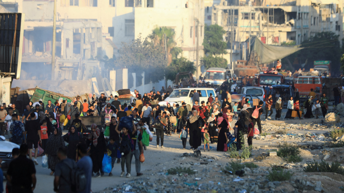 Palestinians evacuate their neighbourhoods in Gaza City following Israeli attacks and evacuation orders on 7 July 2024 (Dawoud Abu Alkas/Reuters)