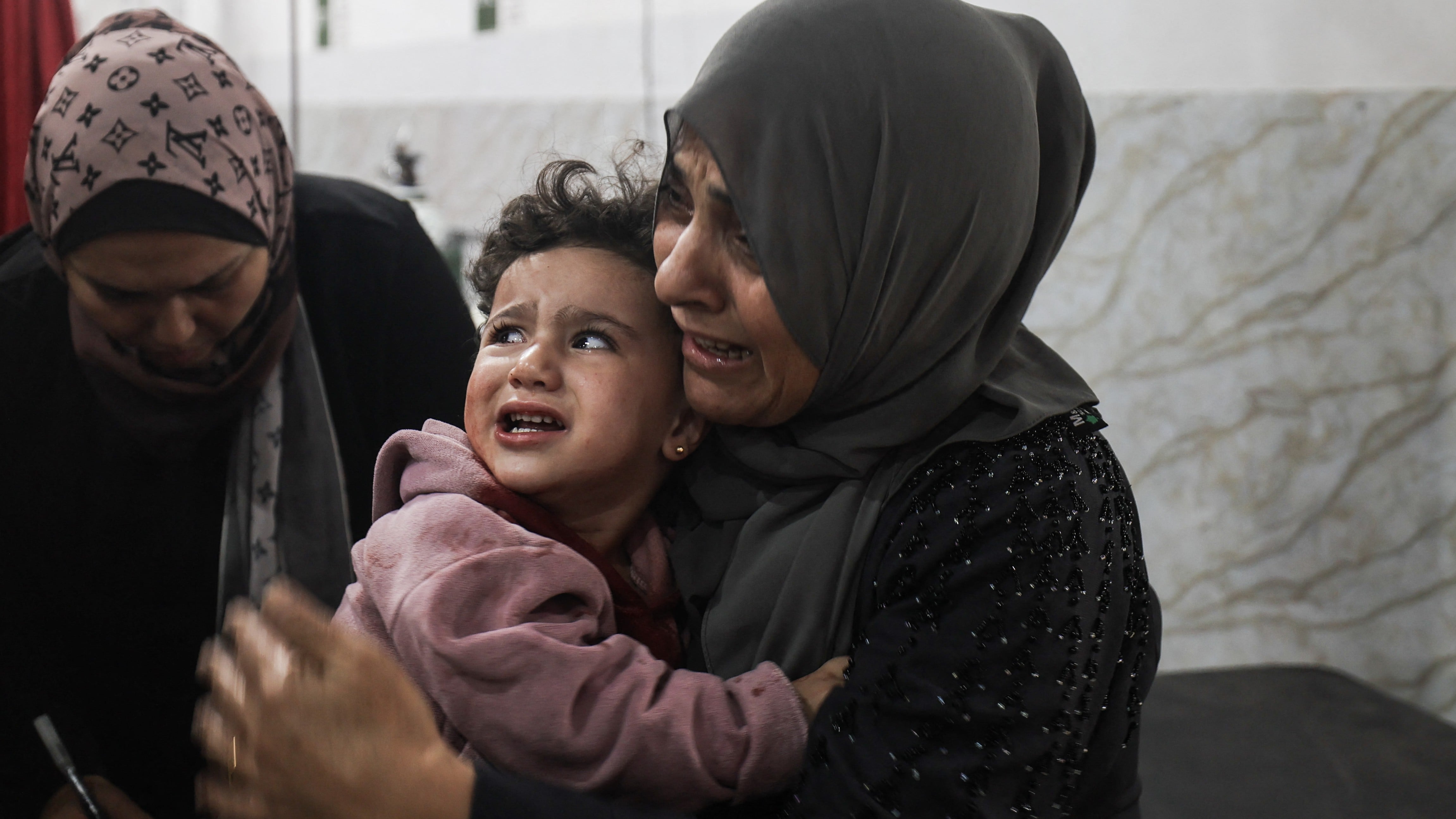 Injured Palestinians at al-Awda Hospital, located in the Nuseirat refugee camp in central Gaza, following Israeli strikes on 22 November 2025 (AFP/Eyad Baba)