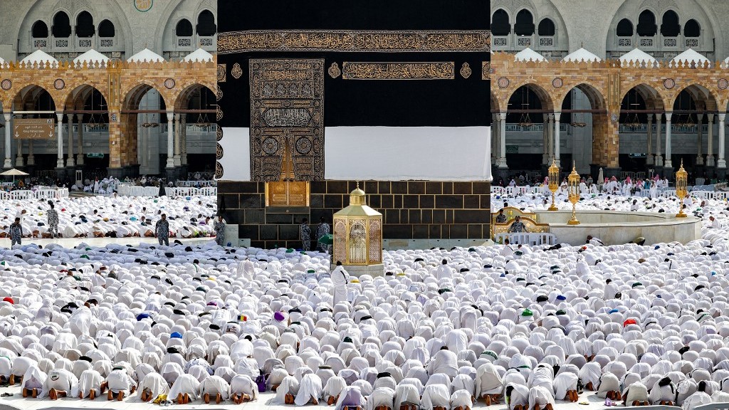 Muslim worshippers pray around the Kaaba, Islam's holiest shrine, at the Grand Mosque in Saudi Arabia's holy city of Mecca on 4 June 2024 (AFP)