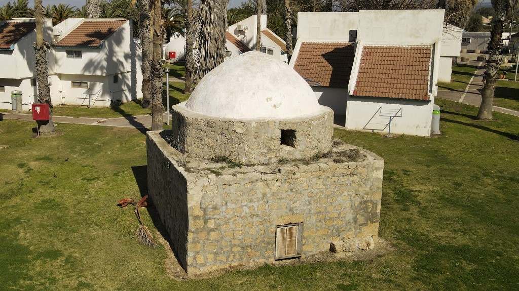 A mausoleum on a beach built over the ruins of Tantura is seen on 25 January 2022 (AFP)
