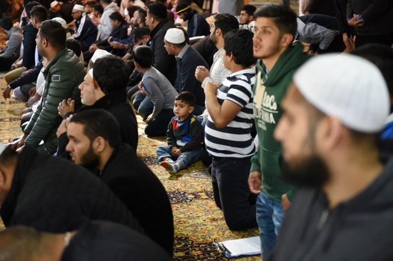 British Muslims are pictured at the Manchester Central Mosque (AFP)