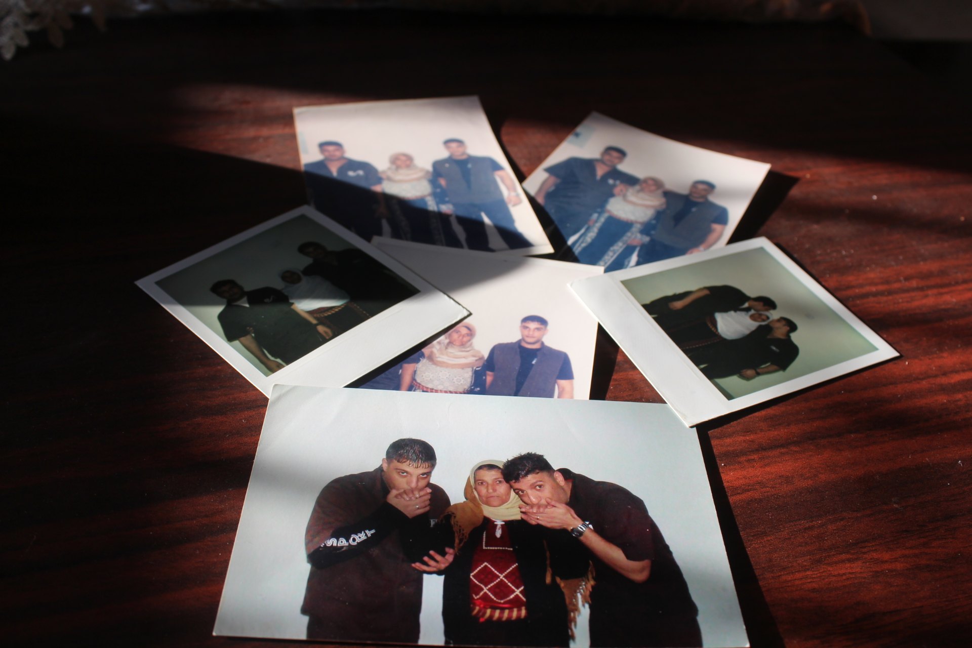 Helwa Hamed's photographs of her sons (MEE/Shatha Hamad)