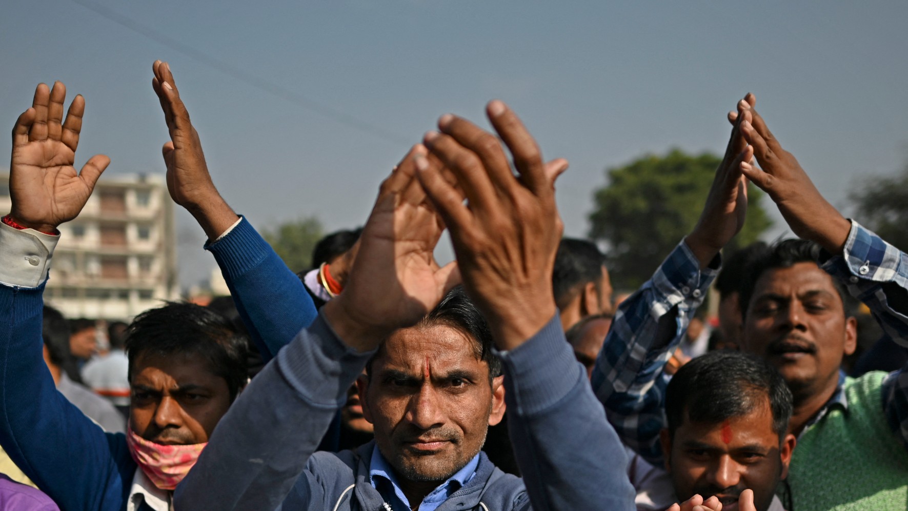  Hindu devotees take part in a religious gathering on the outskirts of New Delhi on 17 December, 2021 (AFP)