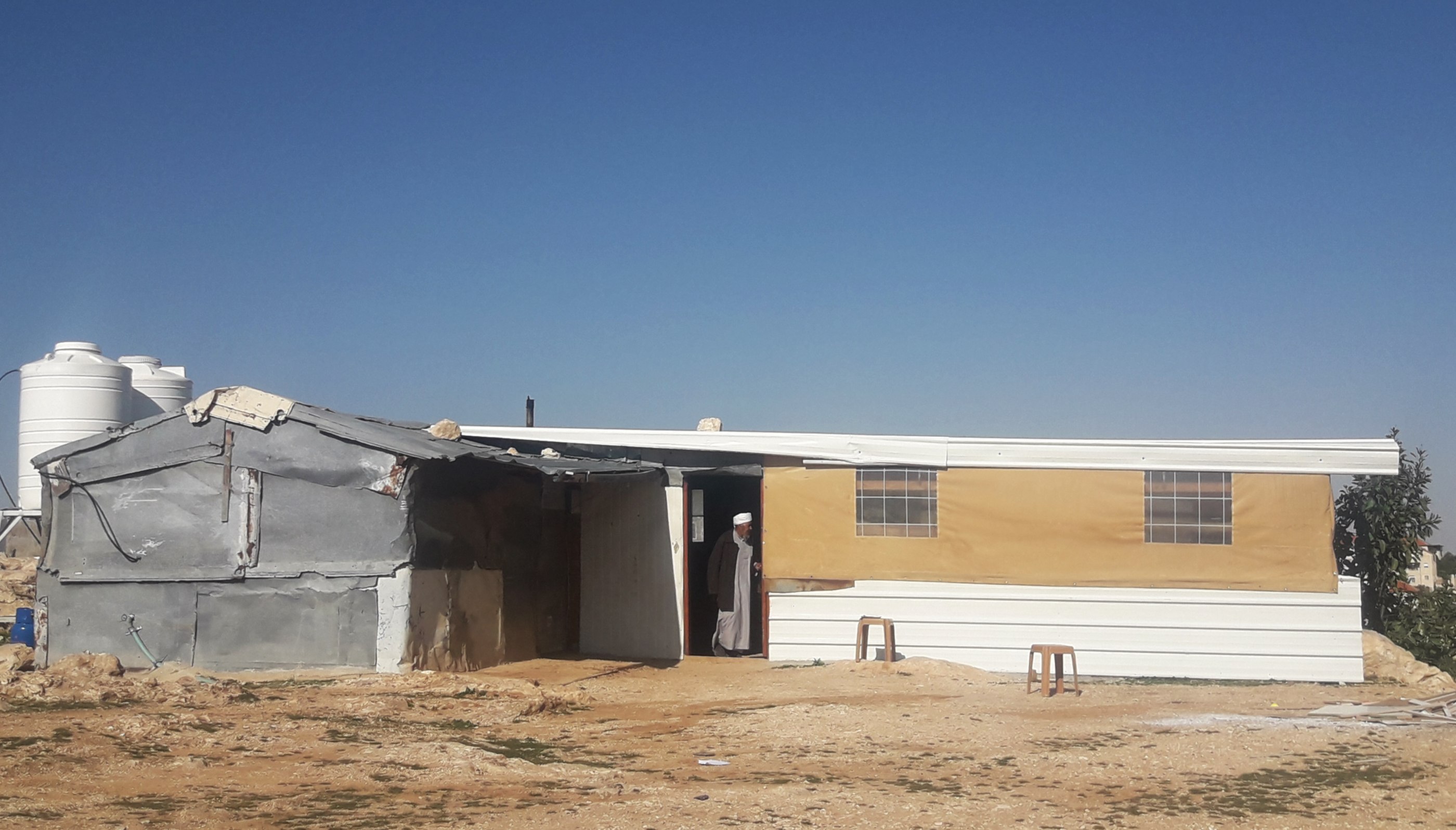 Abu Nuwar's community tent, normally used as a welcome hall for visitors to the village, has been turned into a makeshift school after classrooms were demolished (MEE/Tessa Fox)