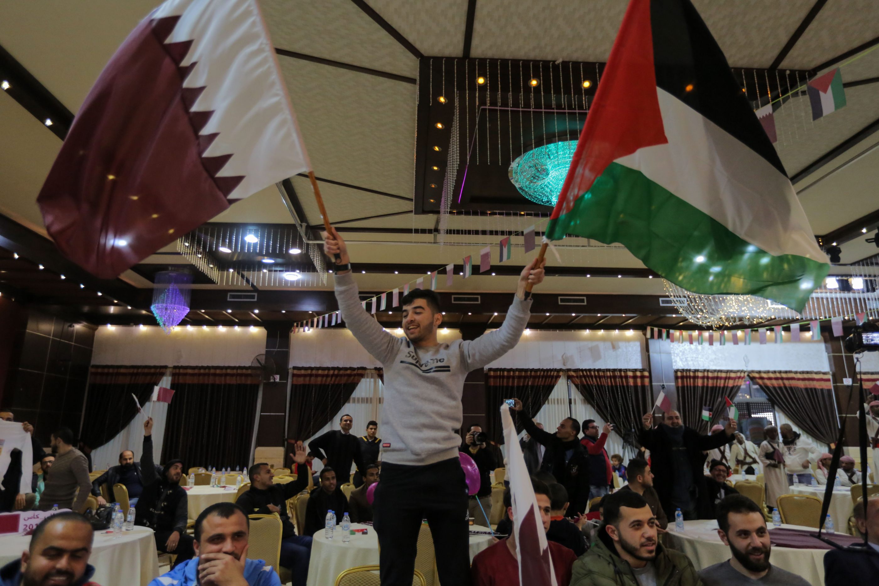 Fans gathered at a tourist complex on the beach of the Gaza Strip to cheer on the Qatari team (MEE/Mohammed al-Hajjar)