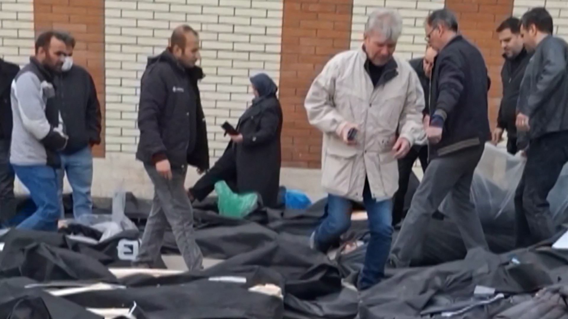 This video grab from 13 January 2026 shows bodies lying on the ground at the Tehran Province Forensic Diagnostic and Laboratory Centre in Kahrizak, as relatives search for their loved ones (AFP)