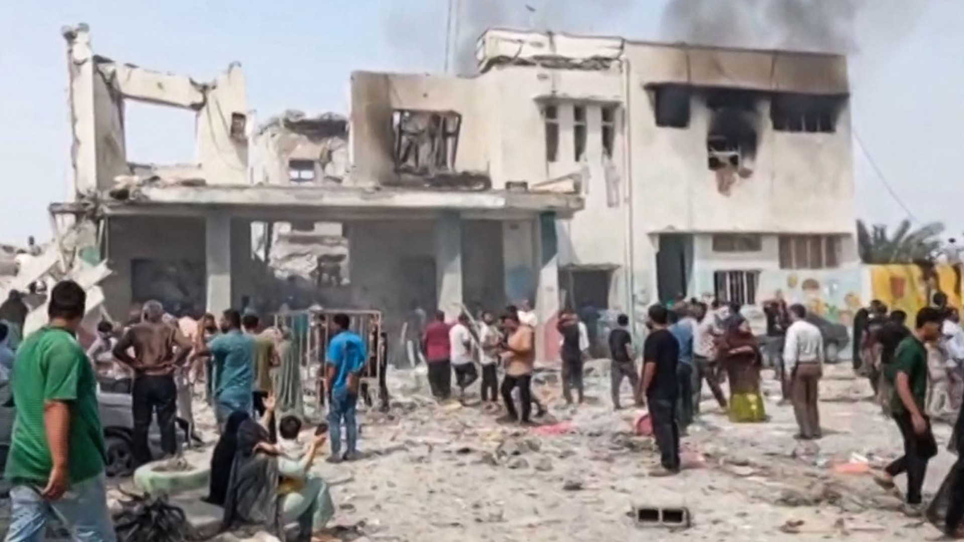 Video posted on pro-government Telegram accounts show Iranians searching through the destroyed school in Minab (Telegram)