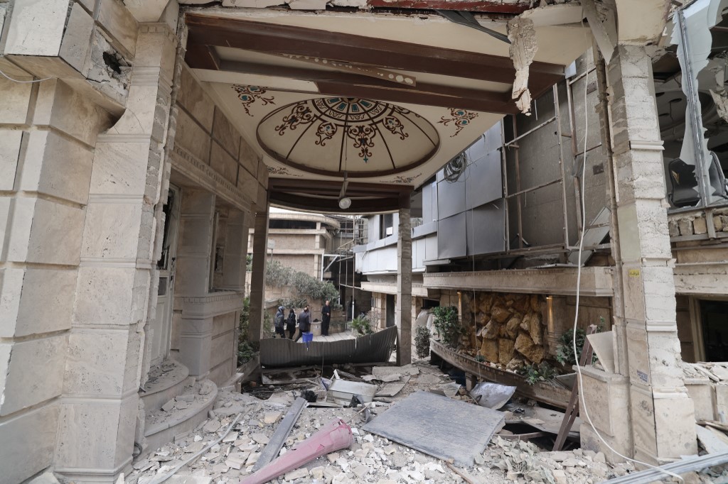 The damaged facade of the Gandi Hospital, which was hit March 1, when a projectile struck a state TV communications tower and nearby buildings across the street, 