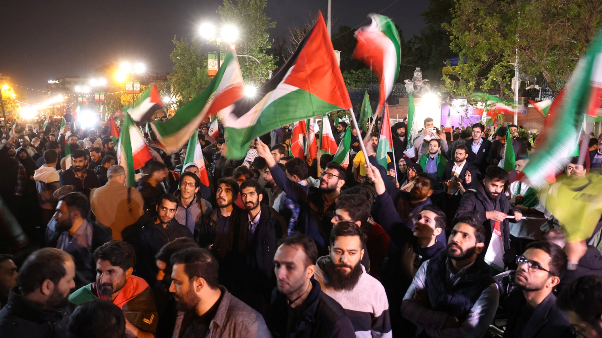 Hundreds of Iranians amassed outside the British Embassy in Tehran to celebrate the retaliatory attacks against Israel on 14 April 2024 (Majid Asgaripour/WANA/Reuters)