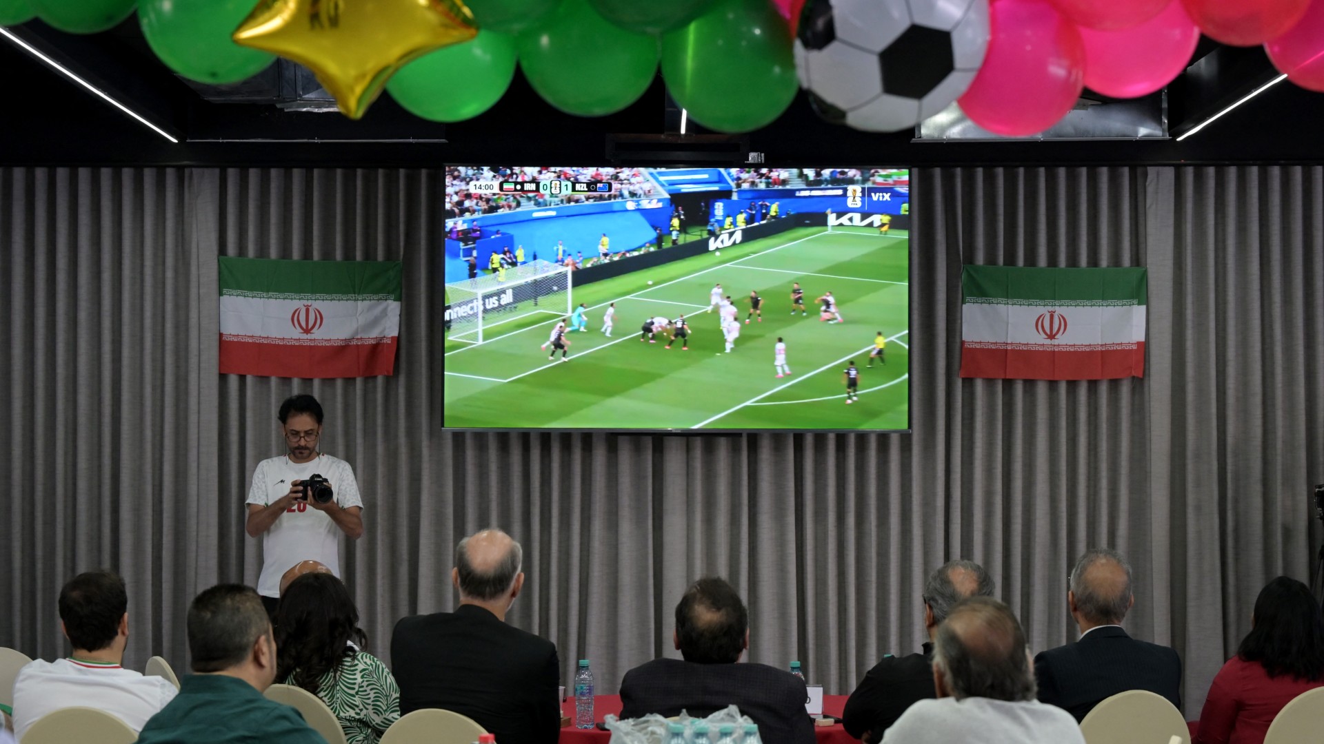 Iran Football Federation Vice President Mehdi Mohammad Nabi and several fans watch Iran’s New Zealand match from Tijuana, Mexico, after being denied entry to the US, 15 June 2026 (Guillermo Arias / AFP)