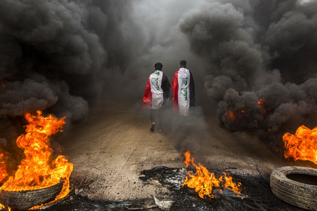 Iraqi anti-government protesters demonstrate in Basra in November 2019 (AFP)