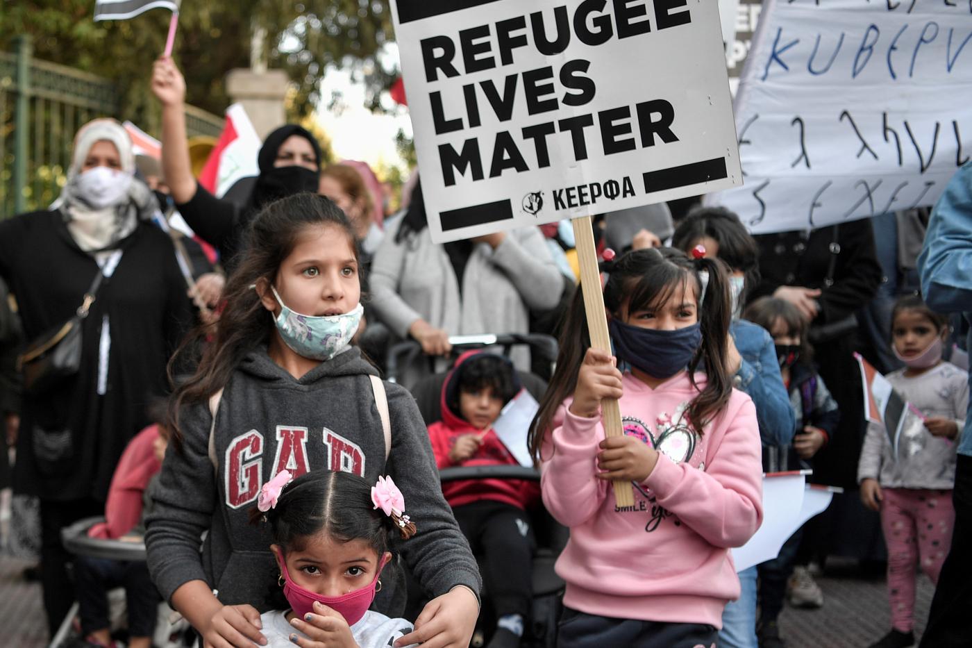 Iraqi refugees, most of them vulnerable people, protest in front of the European Union offices in Athens to demand improvement of the conditions for Iraqi refugees in the country on 20 October (AFP)