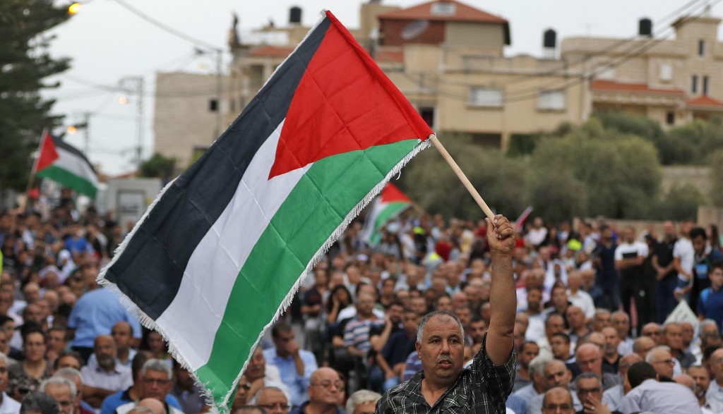 Protesters denounce Israel’s nation-state law in the village of Jatt in October 2018 (AFP)