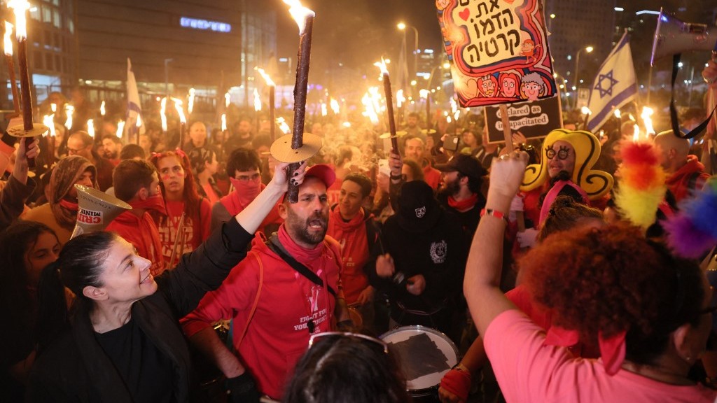 Israelis rally against the new hard-right government in Tel Aviv on 21 January 2023 (AFP)