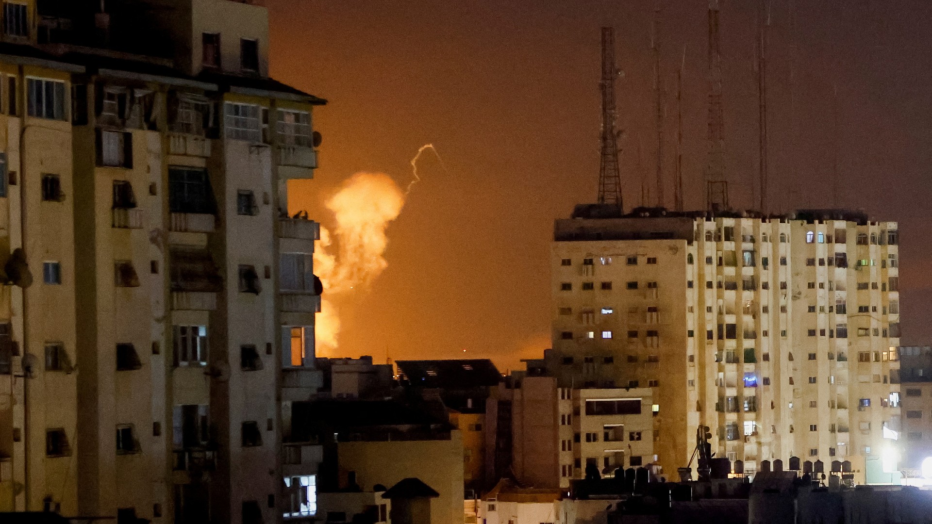 Smoke rises amid buildings during Israeli airstrikes on the besieged Gaza Strip on 7 April 2023 (Reuters)