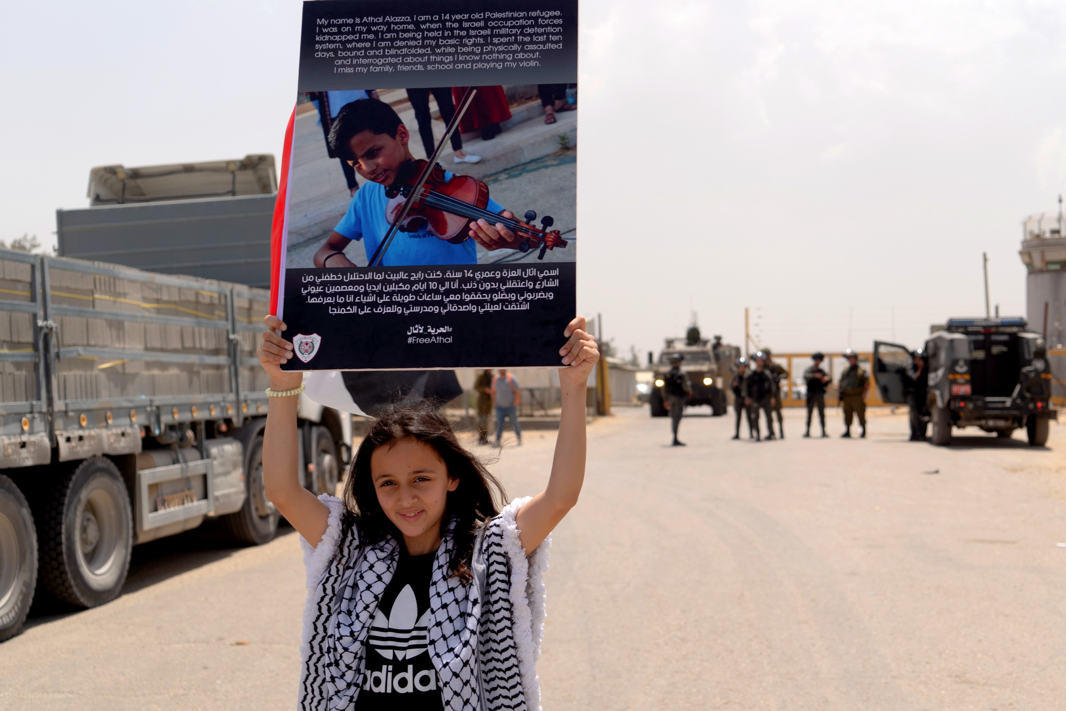 Athal's classmates and friends demonstrate for his release outside the Ofer prison in Ramallah on 26 April 2022. (MEE/Amjad Khawaja)