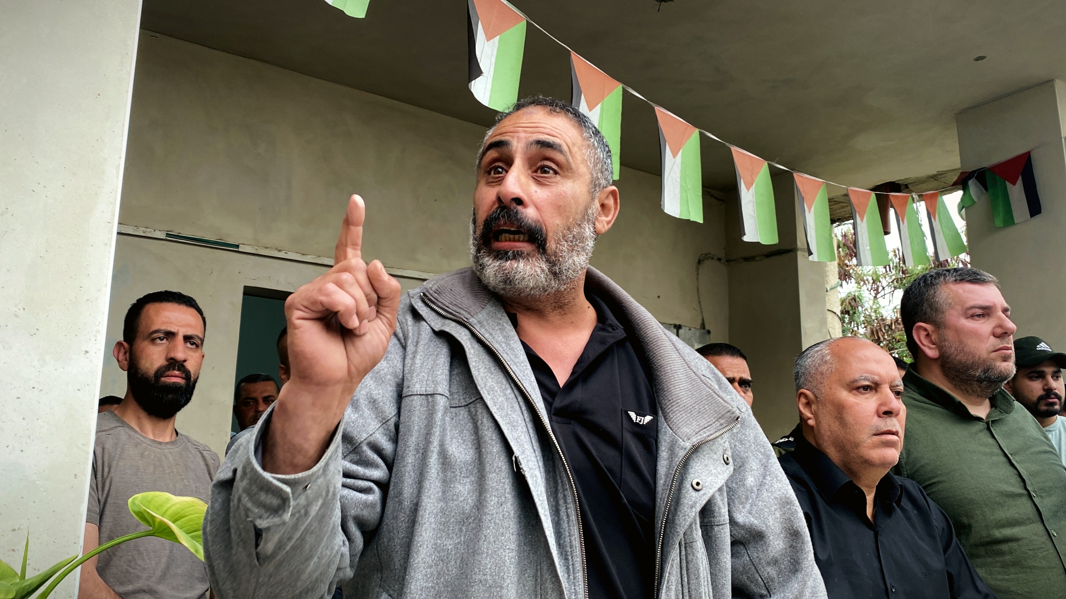 Fathi Hazem gave giving a speech to camp residents who came to support him. (MEE/Shatha Hanaysha) 