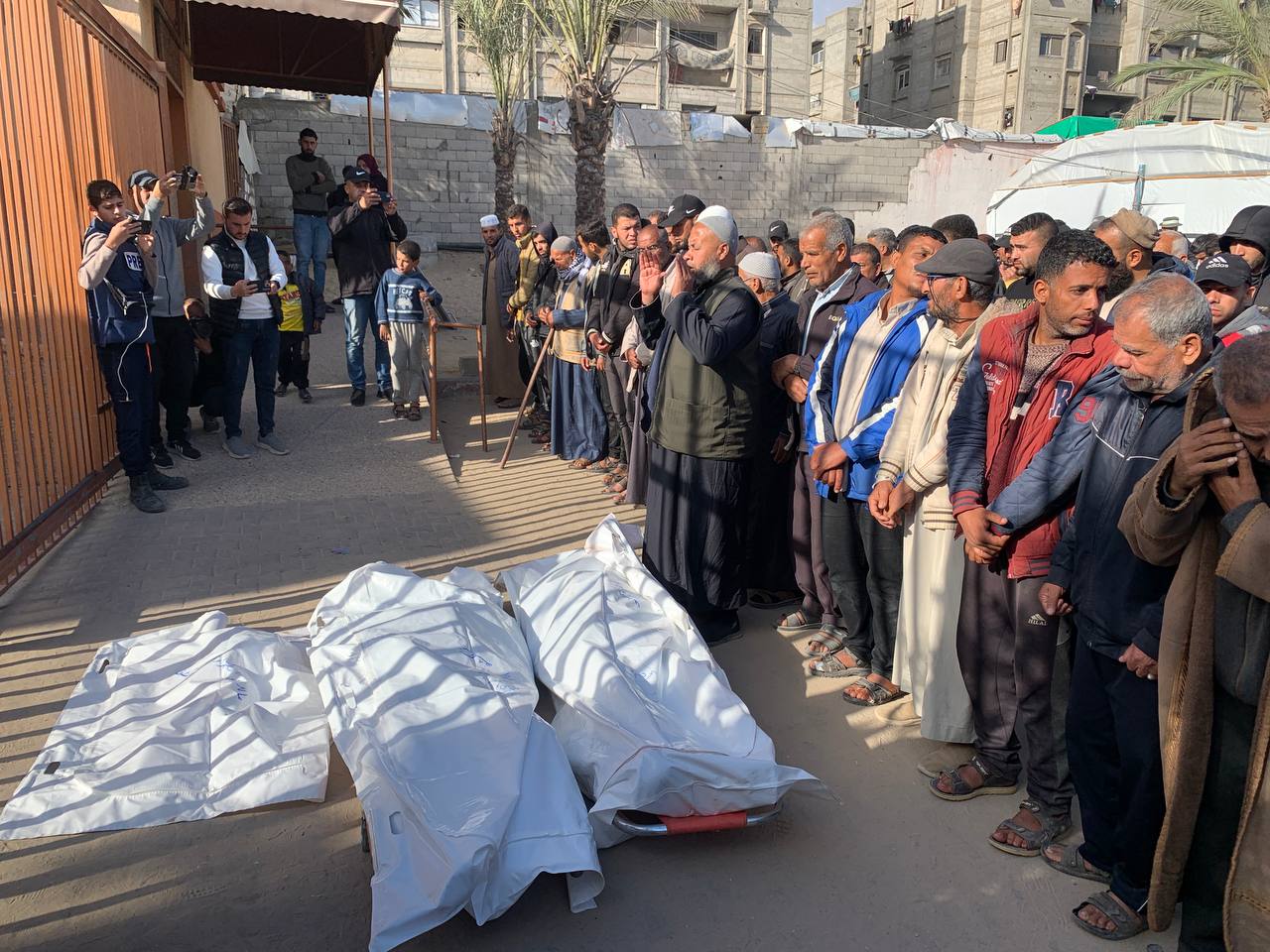 Funeral procession held for Muhammad al-Tahrawi, his father and infant son after they were killed in Israeli strikes on tents sheltering displaced Palestinians in Khan Younis (MEE/Ahmed Aziz)