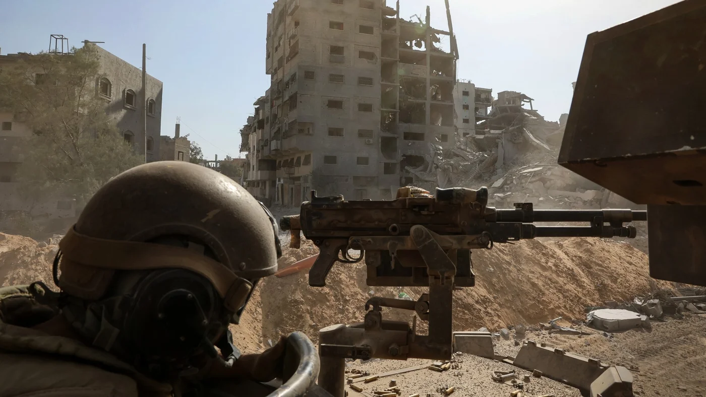 This picture taken during a media tour organised by the Israeli army on 3 October 2025, shows an Israeli soldier in Gaza City (Jack Guez/AFP)