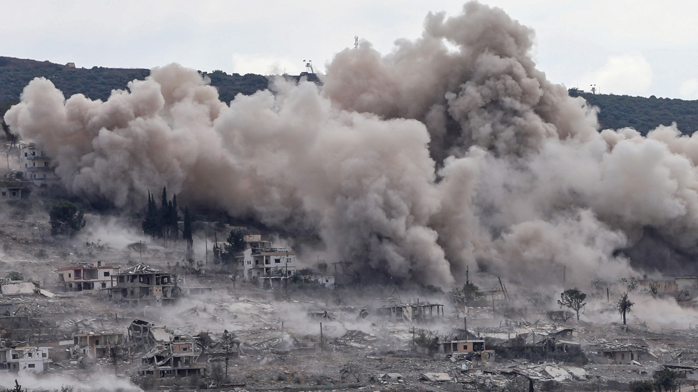 This photograph taken from the southern Lebanese village of Hanniyeh shows smoke rising from the site of a series of Israeli controlled explosions in the nearby village of Mansouri on 28 September 2026 (Kawnat Haju/AFP)