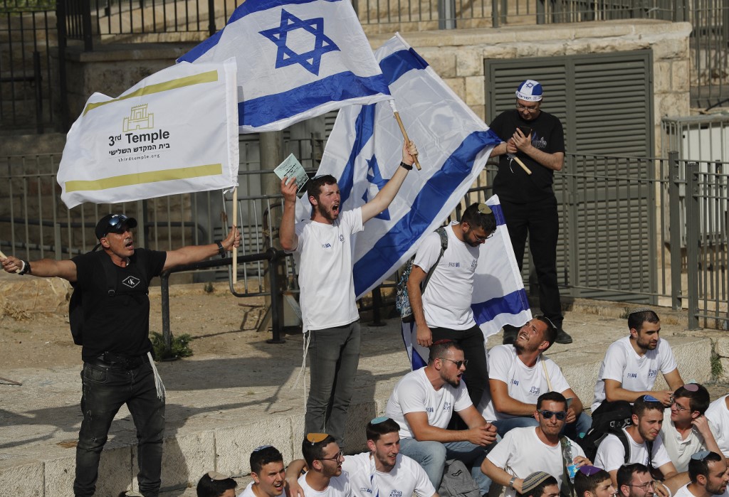 Israeli marchers gather at Damascus Gate in Jerusalem on 29 May 2022 (AFP)