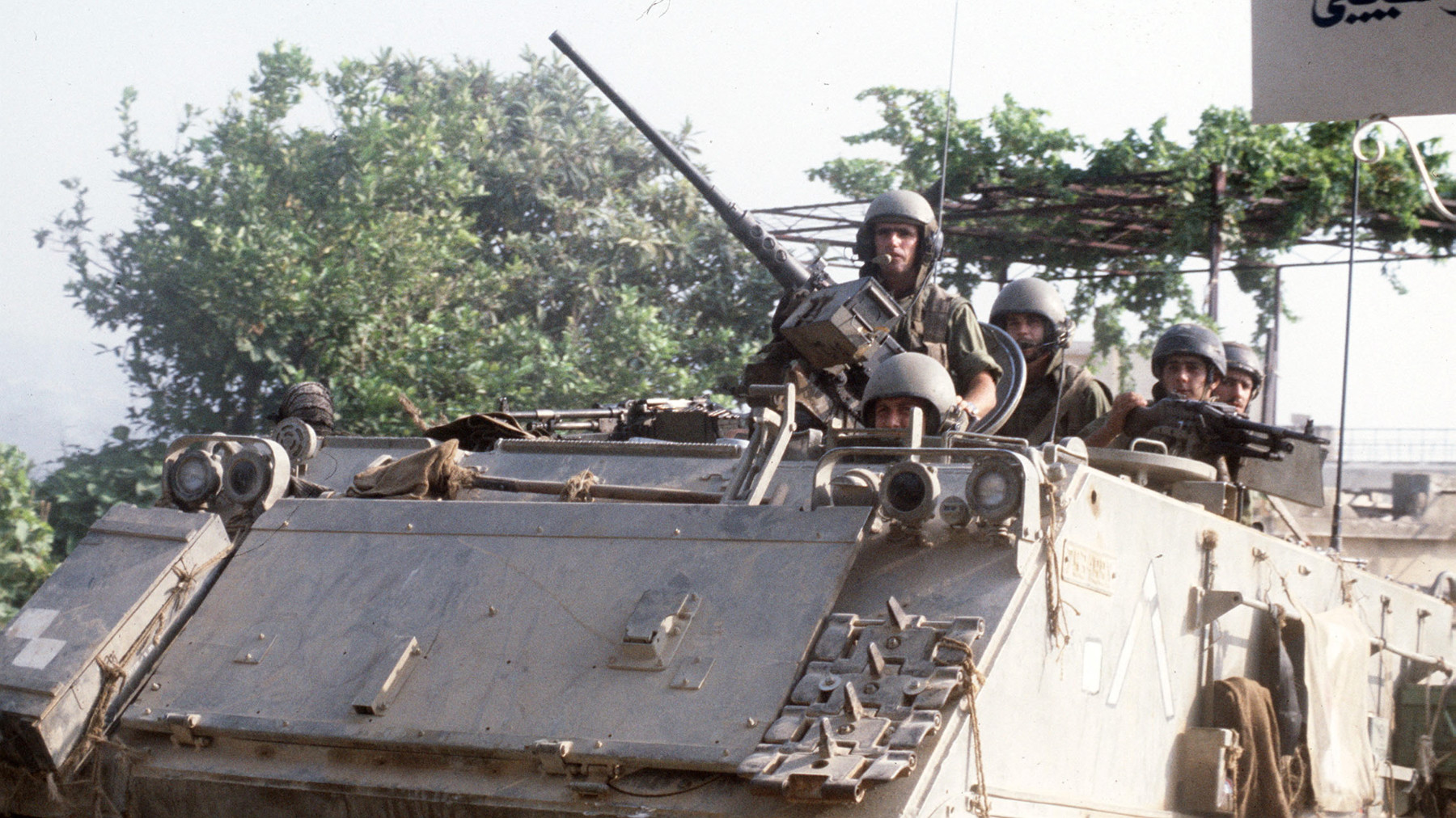 Israeli soldiers on watch in an armoured vehicle in Beirut,  21 July 1982 (Dominique Faget/AFP)