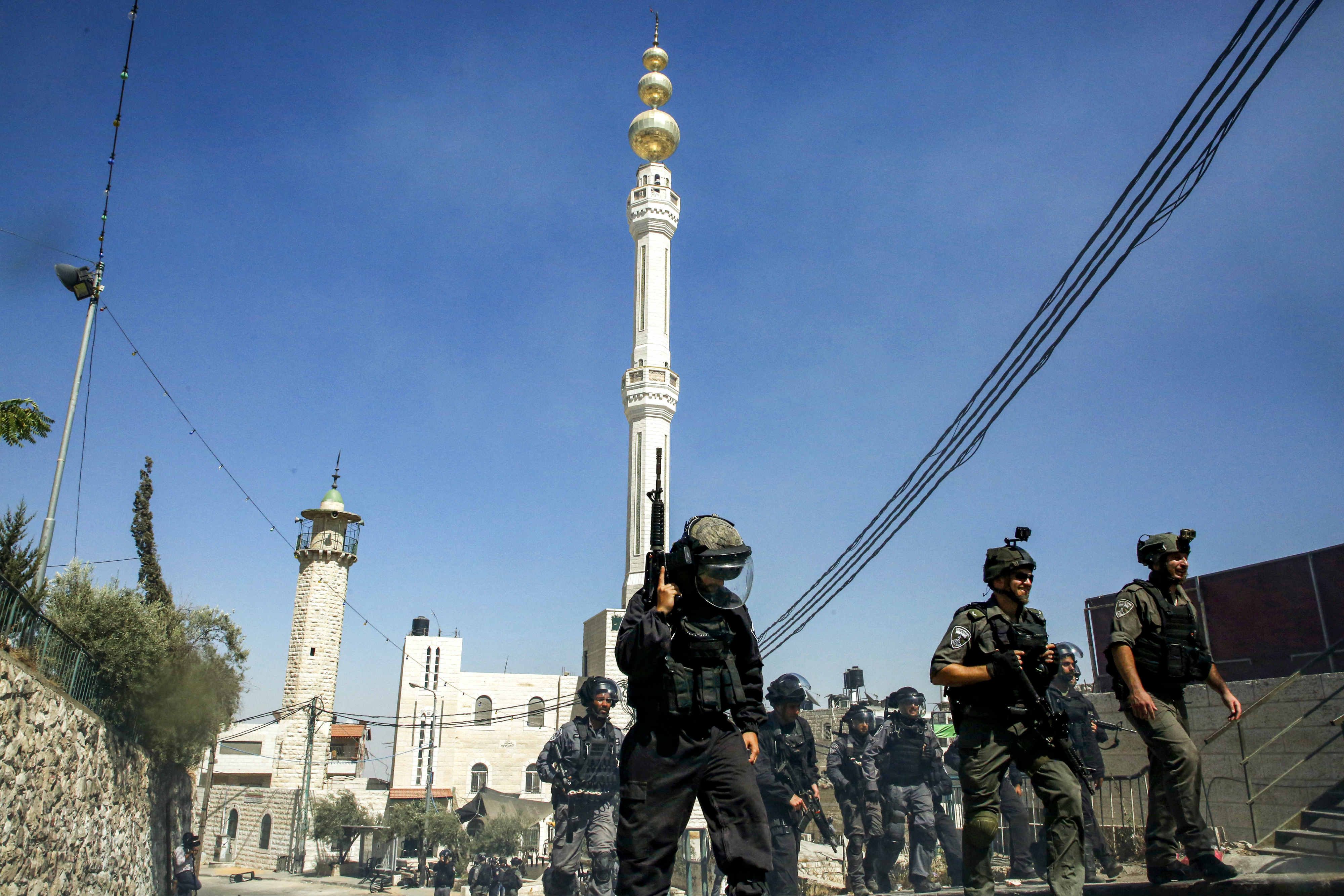 Israeli security forces seen on the streets of Issawiya (AFP)