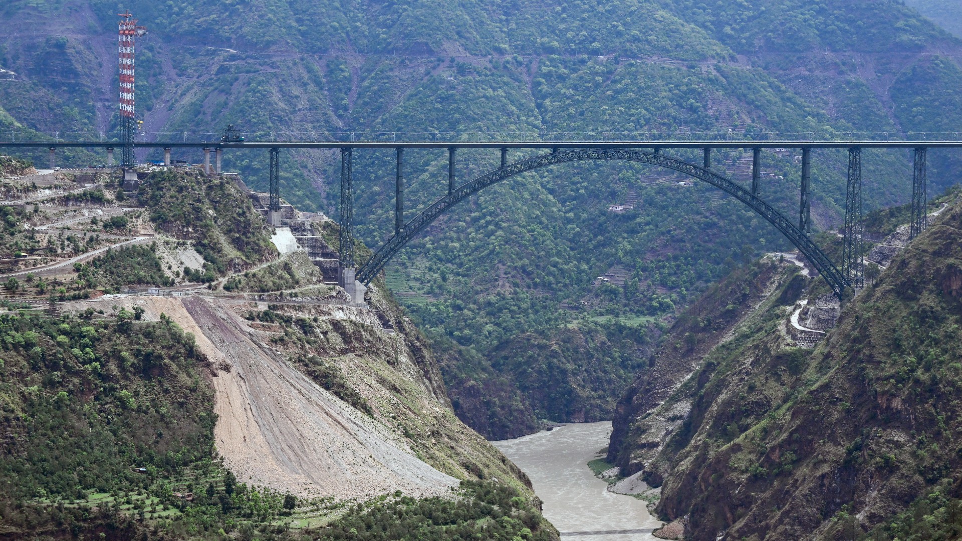 A general view of Chenab bridge, the world's highest rail arch bridge in Reasi, Jammu and Kashmir on July 6, 2024 (Tauseef Mustafa/ AFP)