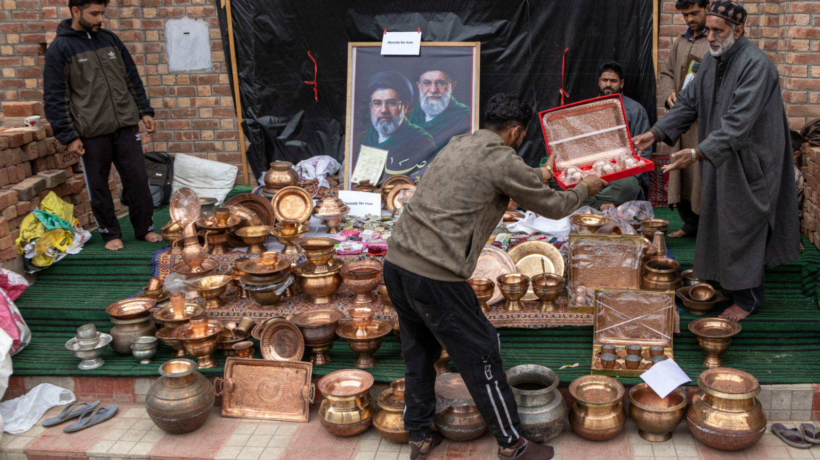 Families flocked to donation points with copper utensils, savings, livestock to contribute toward humanitarian efforts in Iran (Umar Farooq/MEE)