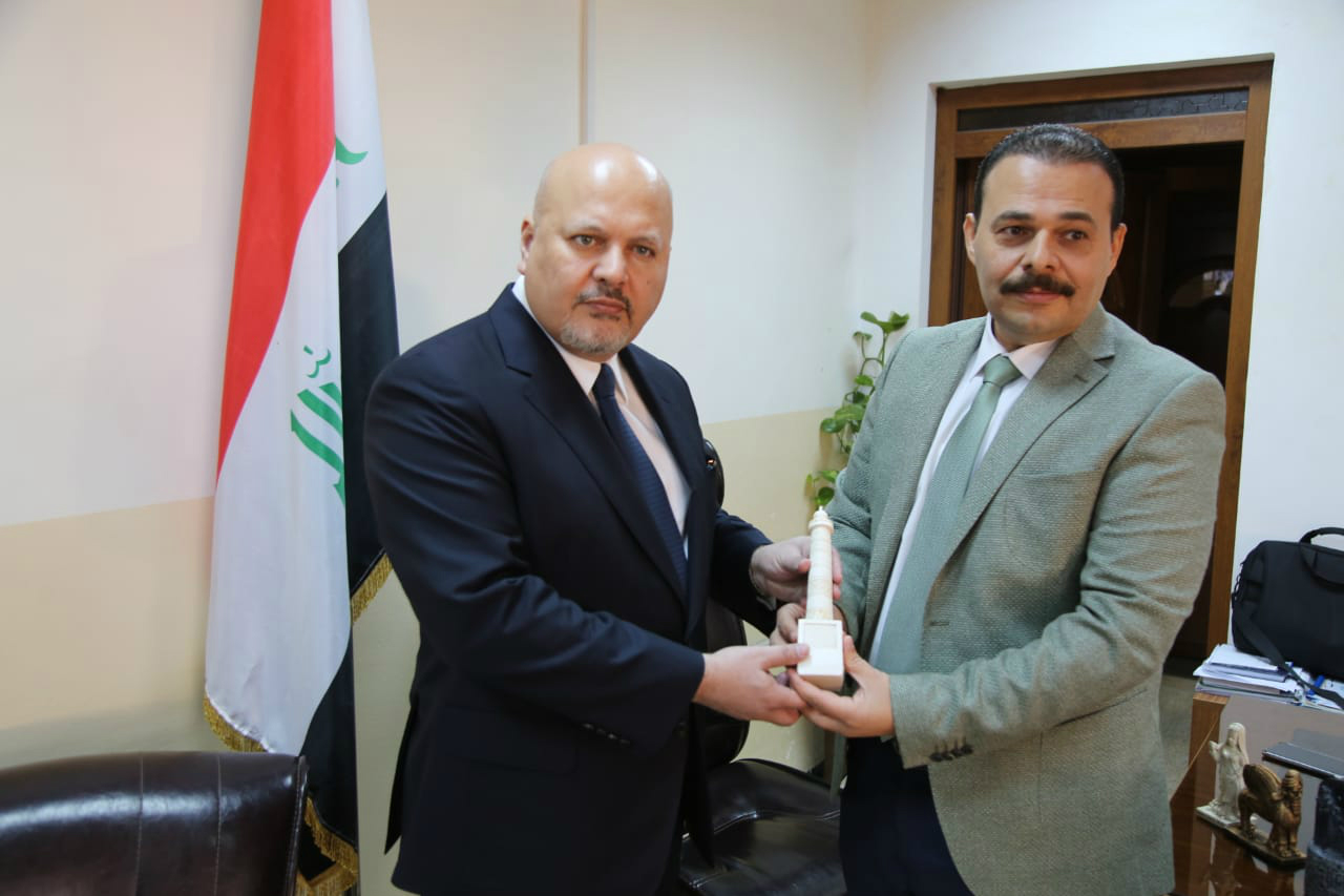 Judge Raed al-Maslah, right, meets with international criminal and human rights lawyer Karim Asad Khan (MEE/Marta Bellingreri)