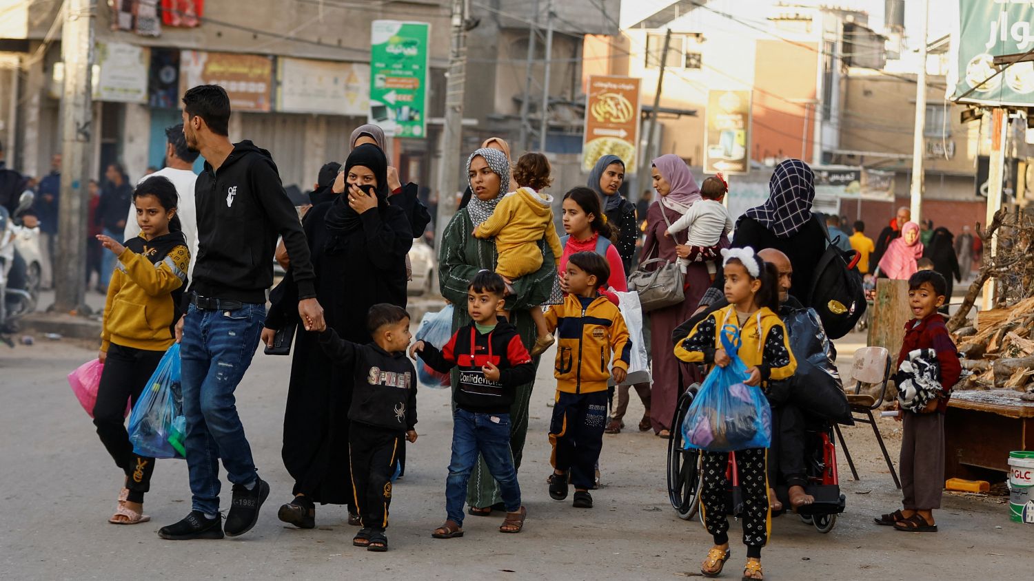 Palestinians walk on a street, during a temporary truce between Hamas and Israel, in Khan Younis in the southern&nbsp;Gaza&nbsp;Strip, on 24 November 2023.