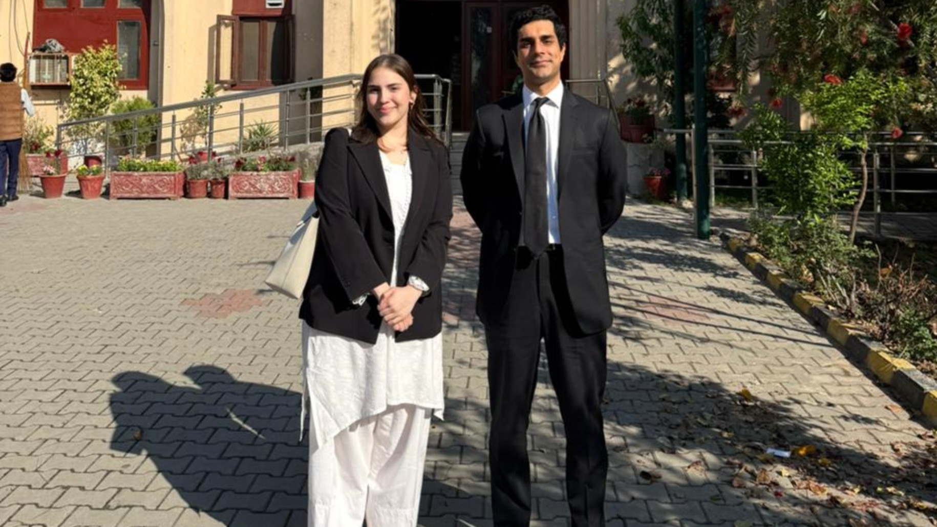 Women’s rights activist and human rights lawyer Mahnoor Omer alongside tax lawyer Ahsan Jahangir Khan at a court hearing in Pakistan regarding the removal of sales tax on sanitary products (supplied)