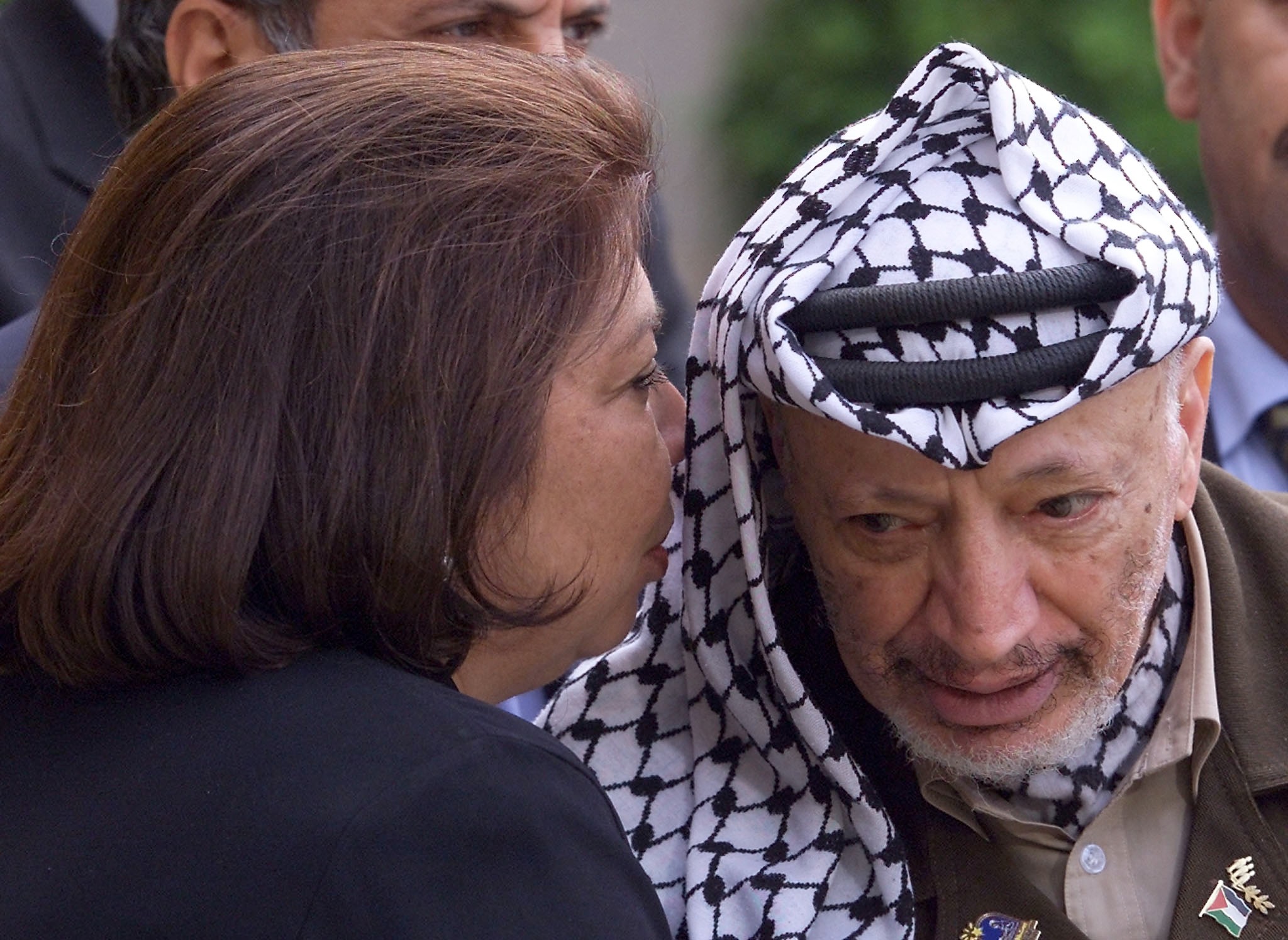 Palestinian leader Yasser Arafat listens to diplomat Leila Shahid, after his meeting with French President Jacques Chirac on 29 July 2000 in Paris (AFP/Georges Gobet)
