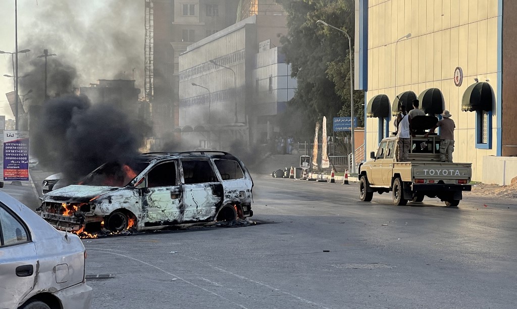 Fighters loyal to Libya’s unity government are pictured in Tripoli after clashes between rival groups on 27 August 2022 (AFP)