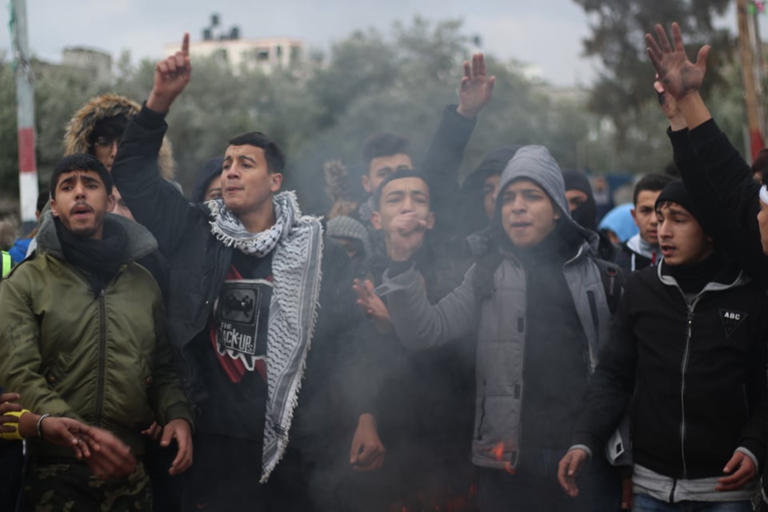 Palestinian high school students demonstrate calling for the return of their three classmates' bodies (MEE/Waleed Mosleh)