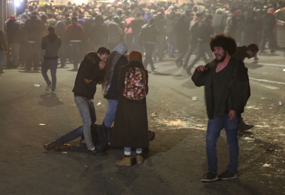 Police used tear gas against protesters in Amman chanting slogans against the government's policies on 13 December (AFP)