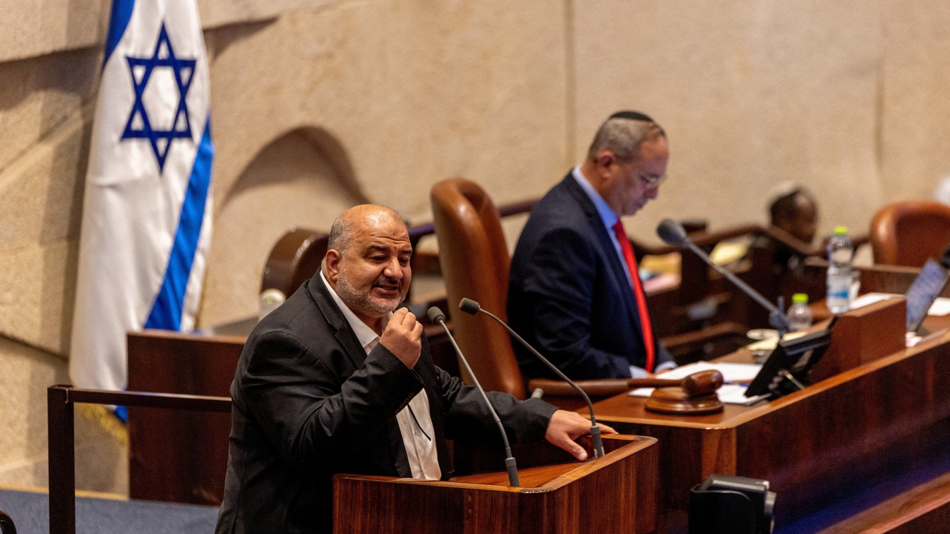 Mansour Abbas, leader of the Raam party, speaks at the plenum at the Knesset, Israel's parliament, in Jerusalem, 13 July 2026 (Reuters/Ronen Zvulun)