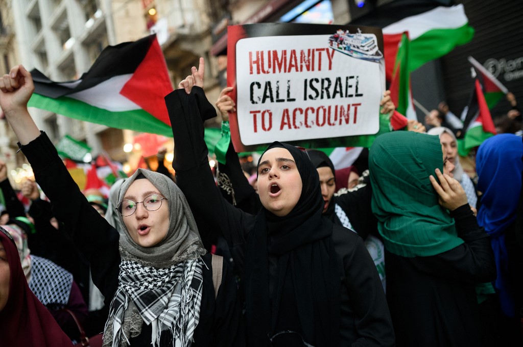 Demonstrators chant slogans during a 2016 rally in Istanbul, Turkey, marking the sixth anniversary of the 2010 Mavi Marmara flotilla incident (AFP)