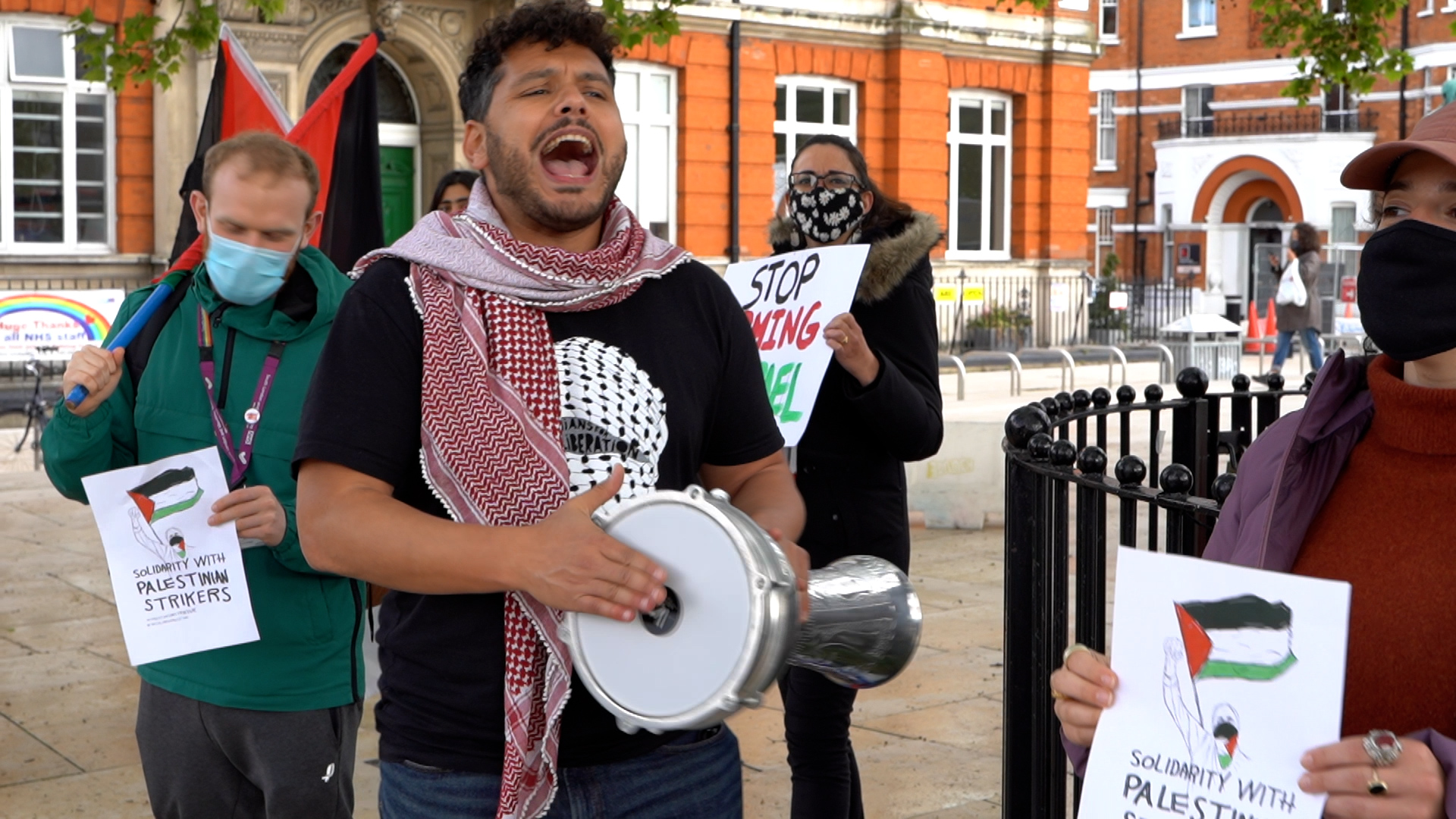 Pro-Palestine activists hold a vigil in London's Brixton (MEE/Katherine Hearst)