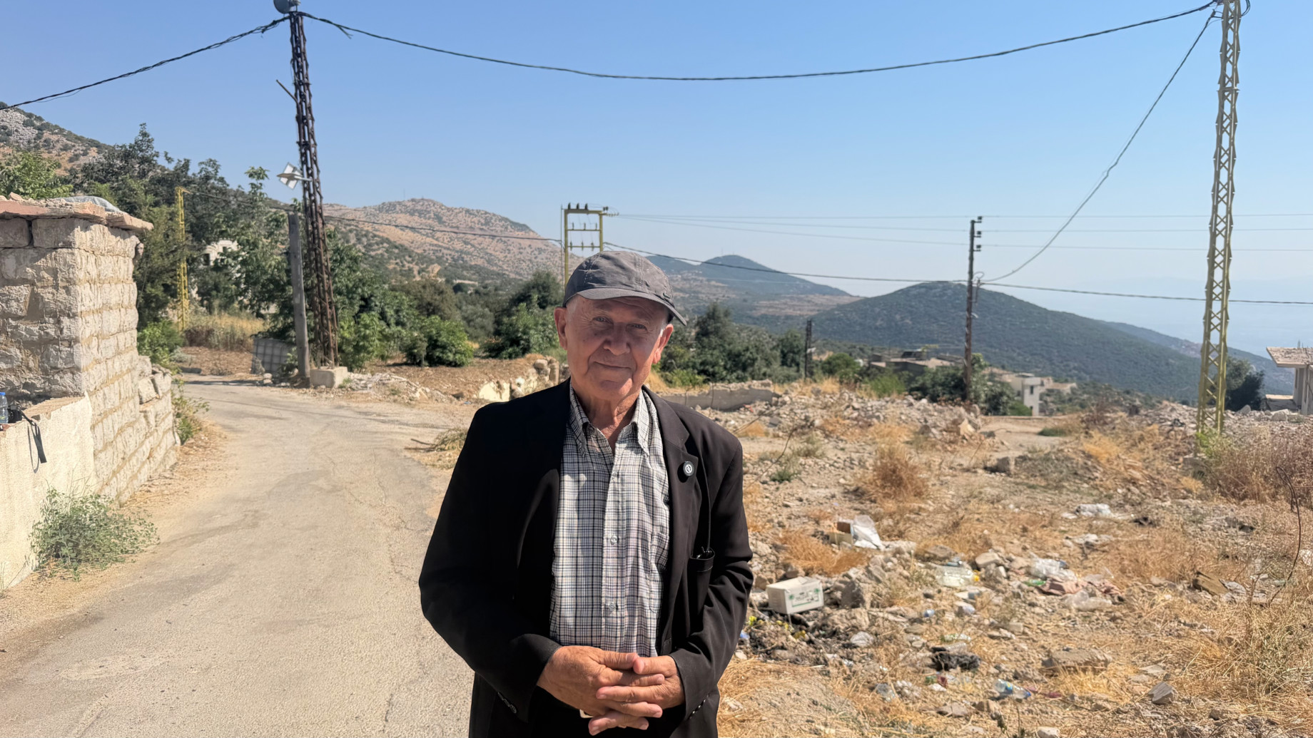 The mayor of Kfarchouba, Qassem Al-Adiri, poses for a photo in the village (Rogger Oliveira/MEE)