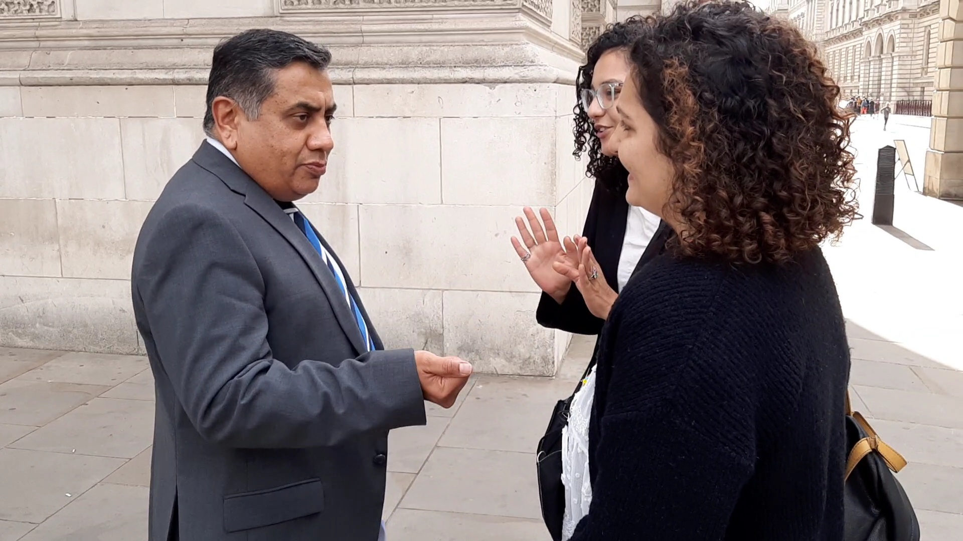 Sanaa and Mona Seif catch up with North Africa Minister Lord Ahmad as he comes from the Foreign Commonwealth and Development Office (MEE/Alex MacDonald)