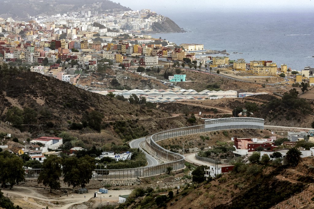 Overview of the border fence between Ceuta and Morocco, near Fnideq, on 30 September (AFP)